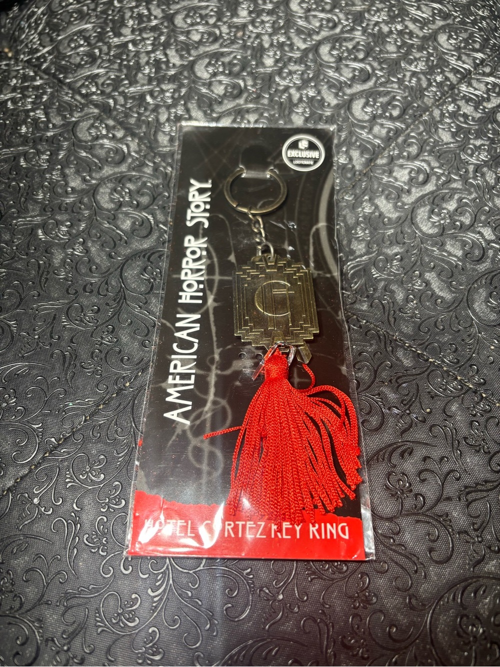 New American Horror Story Red Tassel Keychain - Branded Collectible
